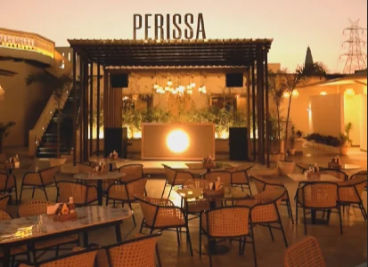 Perissa venue exterior with its name visible above the entrance
